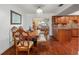 A dining area with wood furniture visible from the kitchen and living room at 5024 37Th E St, Bradenton, FL 34203