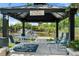 Charming gazebo overlooking the pond, providing a relaxing outdoor retreat with ample seating at 5024 37Th E St, Bradenton, FL 34203
