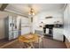 Well-equipped kitchen with stainless steel appliances, ample counter space, and cozy dining area, ideal for culinary enthusiasts at 5024 37Th E St, Bradenton, FL 34203