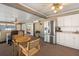 Open living area with stainless steel appliances, white cabinetry, and adjacent seating, ideal for both relaxing and dining at 5024 37Th E St, Bradenton, FL 34203