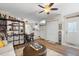 Open-concept living area with sleek furniture, laminate flooring, and a view of the kitchen at 5024 37Th E St, Bradenton, FL 34203