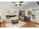 Inviting living room featuring a ceiling fan, and a cozy seating area with elegant decor at 5024 37Th E St, Bradenton, FL 34203