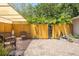 Secluded brick patio with privacy fence, seating area, and lush landscaping at 5024 37Th E St, Bradenton, FL 34203