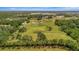 Expansive acreage with open pasture and mature trees, great for outdoor enjoyment at 5235 Spencer Parrish Rd, Parrish, FL 34219