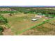 Sprawling property with lush green pastures, mature trees, and fenced boundaries at 5235 Spencer Parrish Rd, Parrish, FL 34219