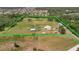 Large lot with green pasture, a home, a barn, and fenced-in area at 5235 Spencer Parrish Rd, Parrish, FL 34219