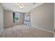Bedroom with carpet, window, and grey paint at 5235 Spencer Parrish Rd, Parrish, FL 34219