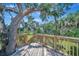 Custom deck built around a mature tree offers scenic views and a relaxing outdoor space at 5235 Spencer Parrish Rd, Parrish, FL 34219
