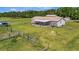 Sprawling property features a home with a covered back porch and ample space for outdoor activities at 5235 Spencer Parrish Rd, Parrish, FL 34219