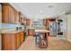 Charming kitchen featuring custom wood cabinetry, an island, and stainless steel appliances at 5235 Spencer Parrish Rd, Parrish, FL 34219