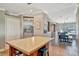 Bright kitchen transitioning to dining area, featuring an island with seating at 5235 Spencer Parrish Rd, Parrish, FL 34219
