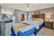 Comfortable main bedroom features natural light, stylish furniture, and access to other rooms at 5235 Spencer Parrish Rd, Parrish, FL 34219
