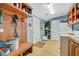 Mud room with bench, wooden wall organizer with hooks, and a convenient laundry area at 5235 Spencer Parrish Rd, Parrish, FL 34219