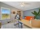 Office space with a large window, desk, an orange sofa, and natural light at 5235 Spencer Parrish Rd, Parrish, FL 34219
