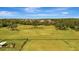 Fenced acreage with green grass and mature trees, perfect for livestock at 5235 Spencer Parrish Rd, Parrish, FL 34219