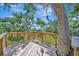 View from a wooden treehouse deck, looking out over the beautiful green lawn at 5235 Spencer Parrish Rd, Parrish, FL 34219