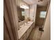 Bathroom featuring a sleek single sink vanity with a large mirror and ample counter space at 5408 Chateau Ln, Bradenton, FL 34207