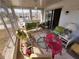 Large lanai with lots of windows offering views of the surrounding community at 5408 Chateau Ln, Bradenton, FL 34207