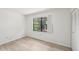 Bright bedroom featuring new floors, closet, and large window providing natural light at 5414 Ansonia Ter, North Port, FL 34287