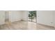 Living room featuring sliding glass door leading to backyard and new floors at 5414 Ansonia Ter, North Port, FL 34287