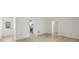 Bright open-concept living space featuring new floors, with doorway into kitchen at 5414 Ansonia Ter, North Port, FL 34287