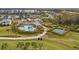 Aerial view of community amenities including pool, playground, basketball court and pavilion at 5583 Summit Gln, Bradenton, FL 34203