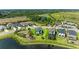 Aerial view of home highlighting its pond view and proximity to community amenities at 5583 Summit Gln, Bradenton, FL 34203