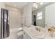 Bright bathroom with tiled shower and modern vanity at 5583 Summit Gln, Bradenton, FL 34203