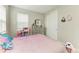 Bedroom with charming decor and lots of natural light at 5583 Summit Gln, Bradenton, FL 34203
