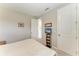 Cozy bedroom featuring neutral walls, carpet flooring, and a wall-mounted television for relaxed viewing at 5583 Summit Gln, Bradenton, FL 34203