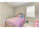 Cozy bedroom featuring whimsical decor and a comfortable bed at 5583 Summit Gln, Bradenton, FL 34203