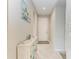Entryway features tile floors, a white accent table, and a painting of palm trees at 5583 Summit Gln, Bradenton, FL 34203