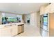 Open kitchen features stainless steel appliances and overlooks the living area at 5583 Summit Gln, Bradenton, FL 34203