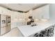 Modern kitchen featuring white cabinets, stainless steel appliances, and quartz countertops at 5583 Summit Gln, Bradenton, FL 34203