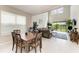 Bright living room features modern furnishings, tile flooring and a high ceiling at 5583 Summit Gln, Bradenton, FL 34203