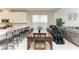 Living space with dining area, stainless steel appliances and white cabinets at 5583 Summit Gln, Bradenton, FL 34203