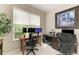Bright office space equipped with dual workstations, natural light, and contemporary decor for productivity at 5583 Summit Gln, Bradenton, FL 34203