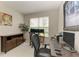 Functional home office featuring a desk with multiple monitors, a printer, and natural light from the window at 5583 Summit Gln, Bradenton, FL 34203