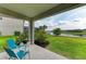 Relaxing patio view with seating overlooking a serene lake and lush landscaping, ideal for outdoor enjoyment at 5583 Summit Gln, Bradenton, FL 34203