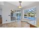 Sun room provides view of backyard pool, tiled floor, and access to home at 5711 Garden Lakes Fern, Bradenton, FL 34203