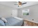Bedroom with window and view, ceiling fan, closet and wood laminate flooring at 5711 Garden Lakes Fern, Bradenton, FL 34203