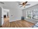 Sun-filled bedroom offers closet space, natural light, and wood floors at 5711 Garden Lakes Fern, Bradenton, FL 34203