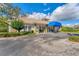 Community clubhouse showcasing its elegant architecture, manicured landscaping, and welcoming entrance at 5711 Garden Lakes Fern, Bradenton, FL 34203