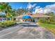 Community clubhouse featuring a welcoming blue awning and well-manicured landscaping in a beautiful neighborhood at 5711 Garden Lakes Fern, Bradenton, FL 34203