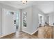 Entryway features decorative glass door, tile flooring, side window, and easy access to interior at 5711 Garden Lakes Fern, Bradenton, FL 34203