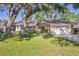 Charming single-story home with a well-manicured lawn and mature trees offering plenty of shade at 5711 Garden Lakes Fern, Bradenton, FL 34203