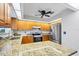 A gorgeous kitchen featuring granite countertops, stainless steel appliances, and ample cabinet space at 5711 Garden Lakes Fern, Bradenton, FL 34203