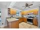 Well-lit kitchen with granite countertops, stainless steel appliances, and ample cabinet space at 5711 Garden Lakes Fern, Bradenton, FL 34203