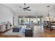 Inviting living room with hardwood floors and sliding glass doors leading to the patio at 5711 Garden Lakes Fern, Bradenton, FL 34203