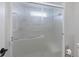 Updated bathroom shower with glass doors and a convenient towel bar at 5711 Garden Lakes Fern, Bradenton, FL 34203